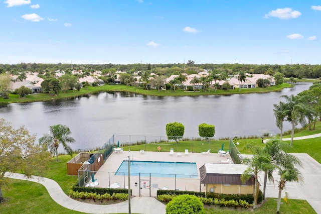 view of pool featuring a water view