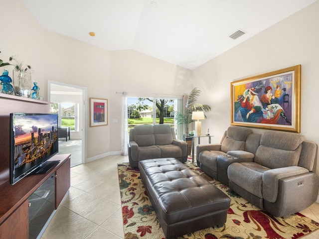 living room featuring high vaulted ceiling and light tile patterned flooring