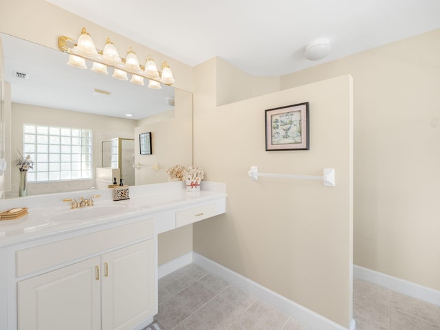 bathroom featuring vanity, a shower, and tile patterned flooring