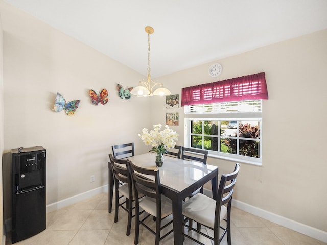 tiled dining area with an inviting chandelier