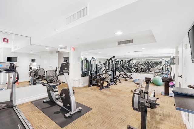 workout area featuring light carpet