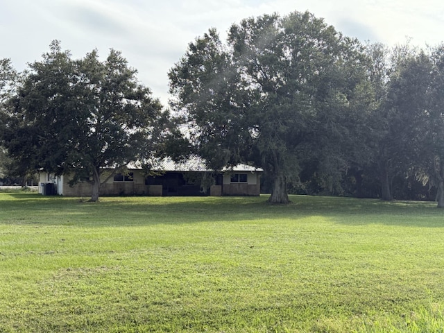 view of yard with central AC