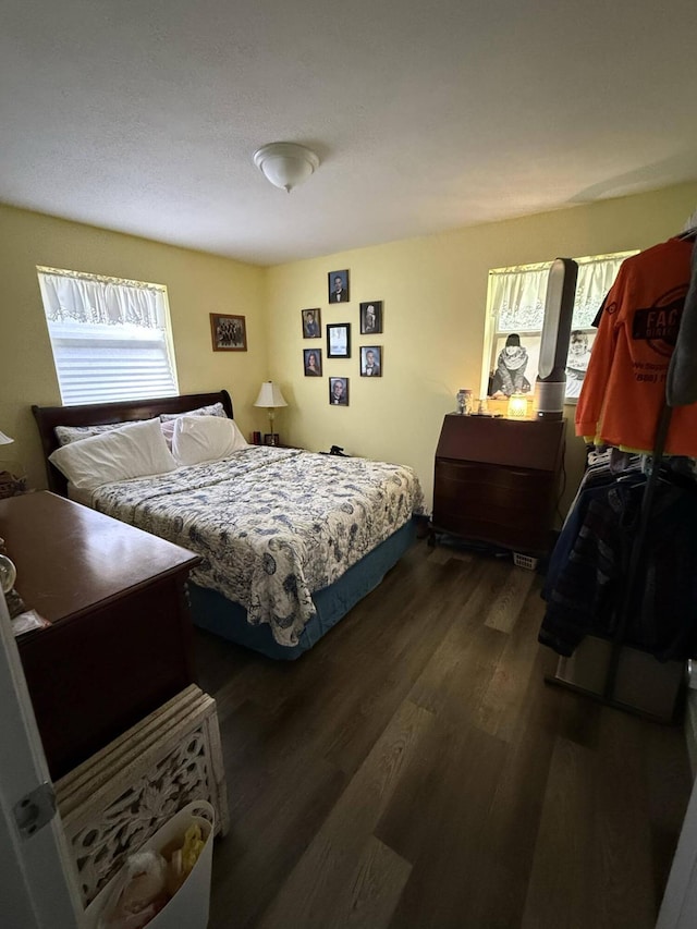 bedroom featuring dark wood-type flooring