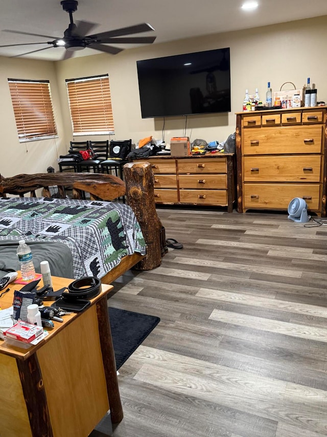 bedroom with wood-type flooring and ceiling fan