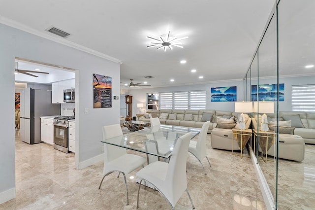 dining room featuring crown molding