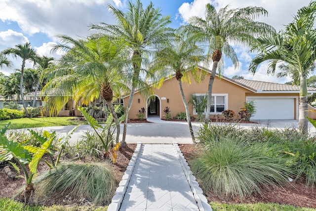 mediterranean / spanish-style house featuring a garage