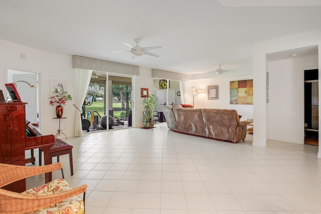 tiled living room with ceiling fan