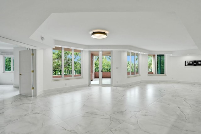 spare room featuring a wealth of natural light