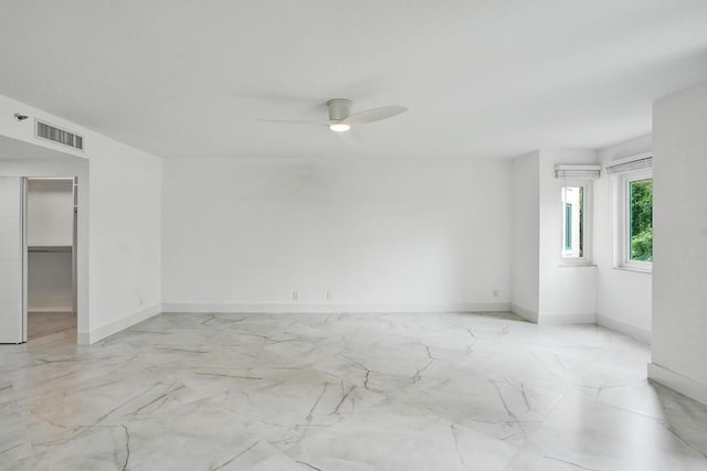 unfurnished room featuring ceiling fan