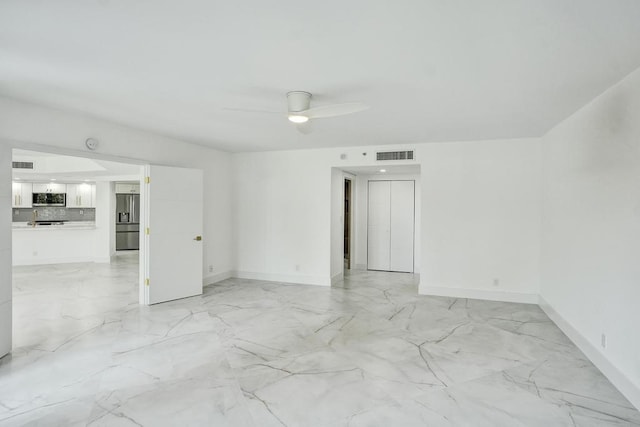 unfurnished room featuring ceiling fan