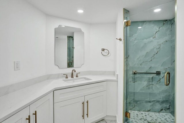 bathroom with vanity and an enclosed shower