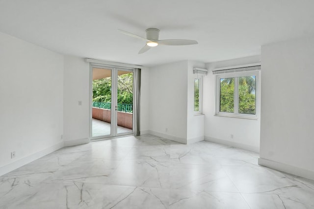 unfurnished room with ceiling fan