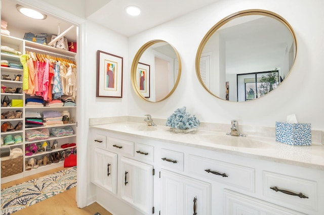 bathroom featuring vanity and wood-type flooring