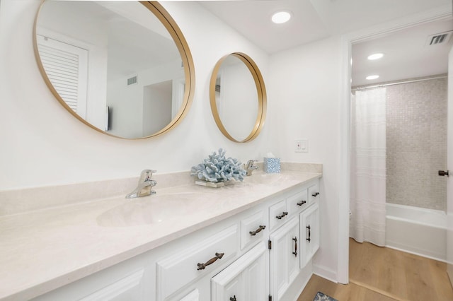 bathroom featuring shower / bath combo, vanity, and hardwood / wood-style flooring