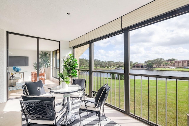 sunroom with a water view