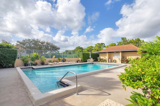 view of swimming pool featuring a patio area