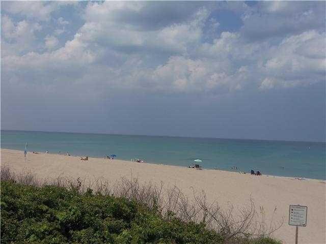 view of water feature with a beach view