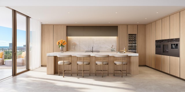 kitchen featuring tasteful backsplash, light countertops, light brown cabinetry, modern cabinets, and a wall of windows