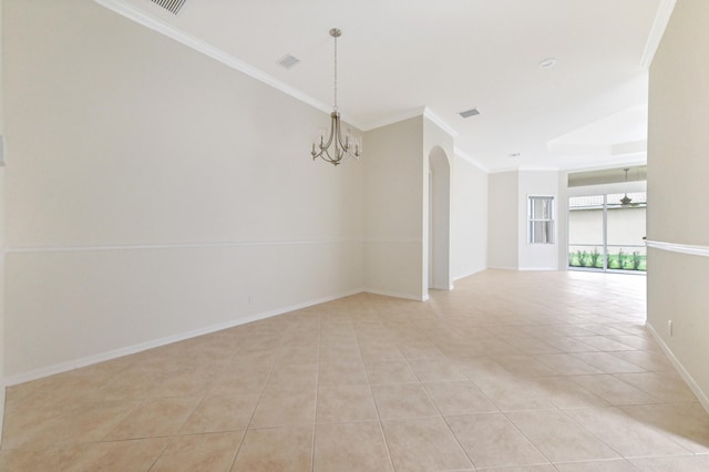 tiled empty room with a chandelier and crown molding