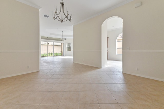 unfurnished room with plenty of natural light, ceiling fan with notable chandelier, and ornamental molding