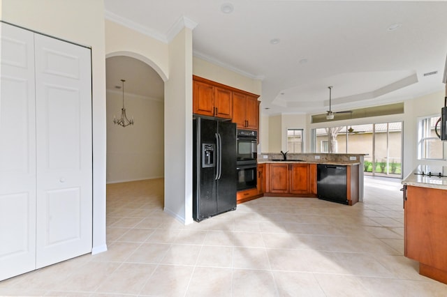 kitchen featuring kitchen peninsula, light tile patterned floors, sink, and black appliances