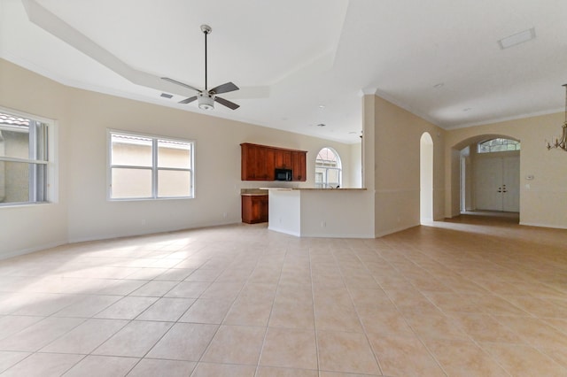 unfurnished living room featuring ceiling fan, light tile patterned flooring, and crown molding