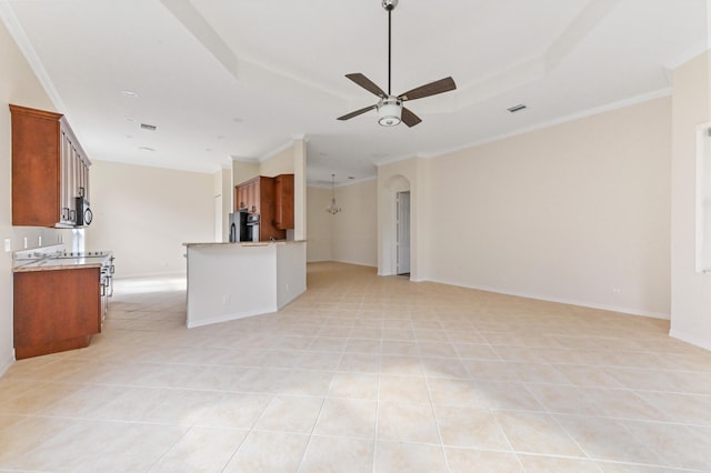 unfurnished living room with ceiling fan, crown molding, and light tile patterned floors