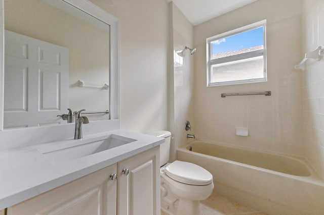 full bathroom featuring toilet, vanity, and tiled shower / bath