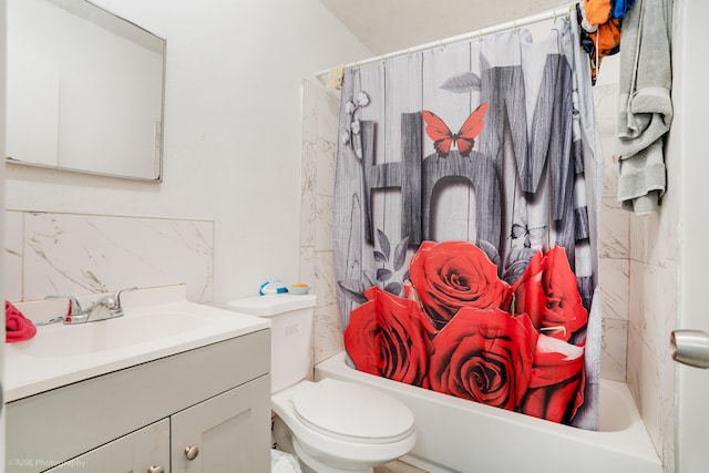 full bathroom with vanity, toilet, and shower / bath combo with shower curtain