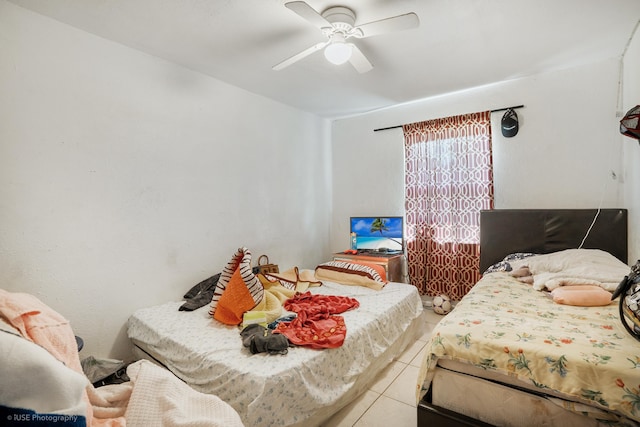 bedroom with tile patterned floors and ceiling fan