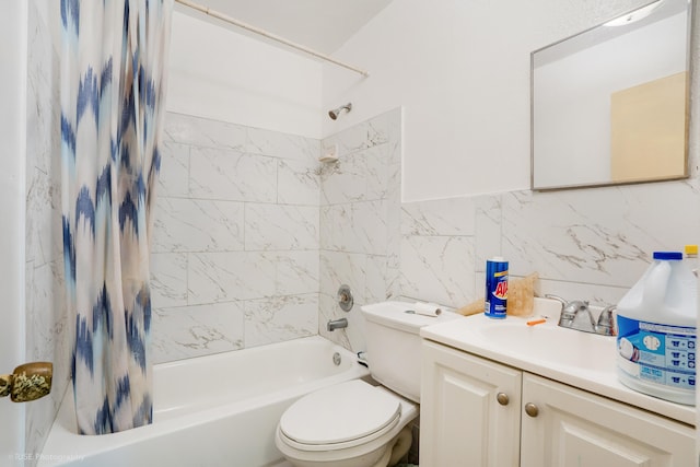 full bathroom featuring toilet, decorative backsplash, shower / bath combo with shower curtain, vanity, and tile walls