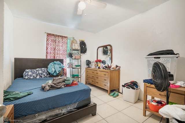 tiled bedroom with ceiling fan