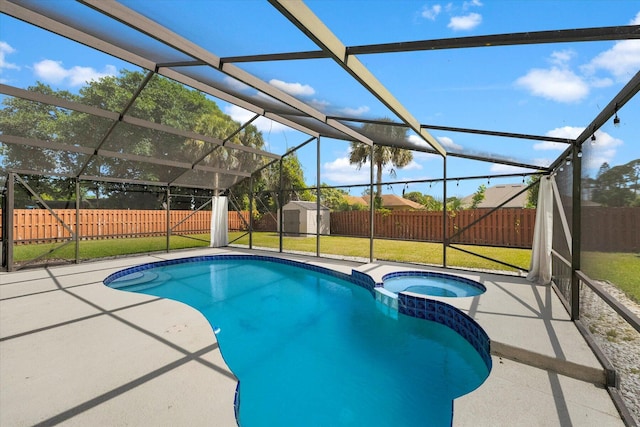 view of pool with a yard, a patio area, a storage unit, and a lanai