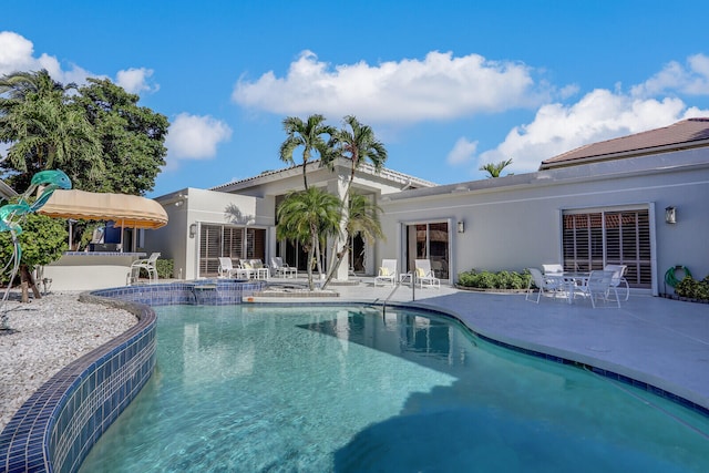 view of pool featuring a patio