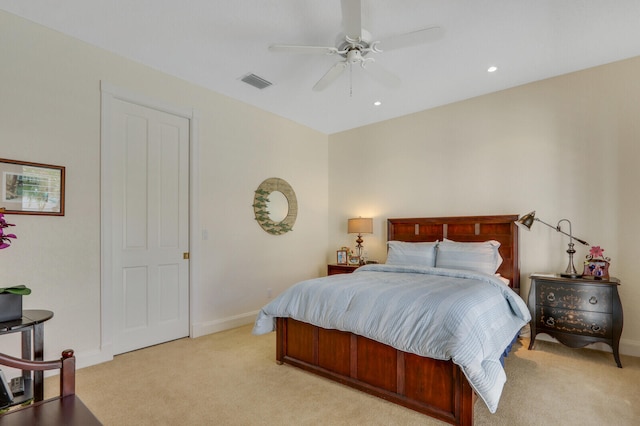 bedroom with ceiling fan and light colored carpet