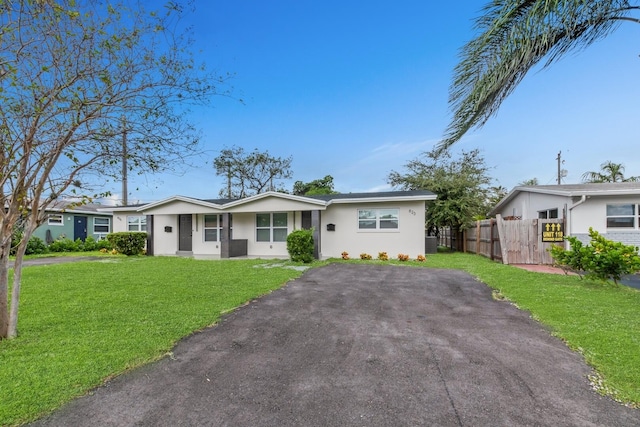 ranch-style house with a front yard