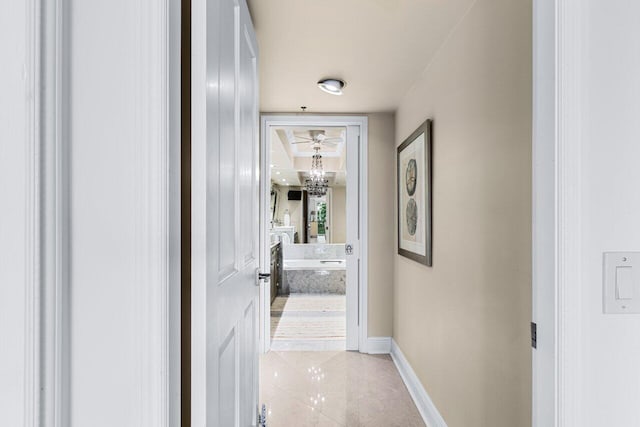 hall featuring light tile patterned floors