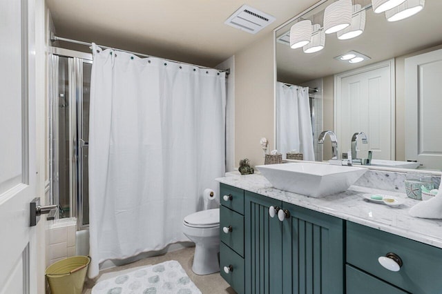 full bathroom featuring vanity, shower / tub combo, and toilet