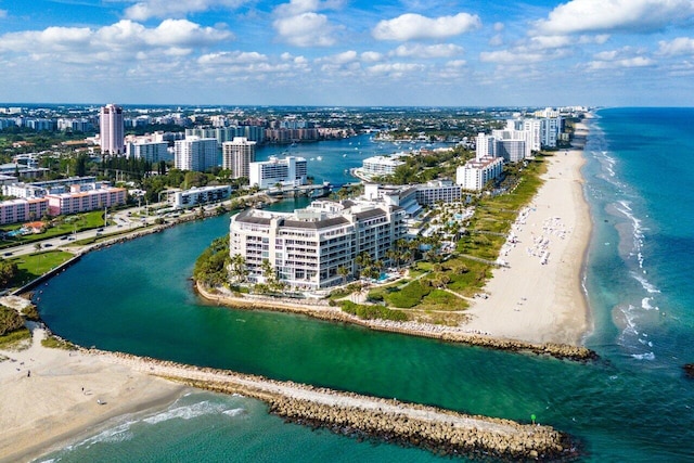 drone / aerial view featuring a beach view and a water view