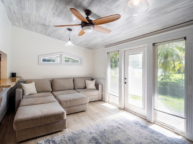 living room with ceiling fan, wood ceiling, lofted ceiling, and light wood-type flooring