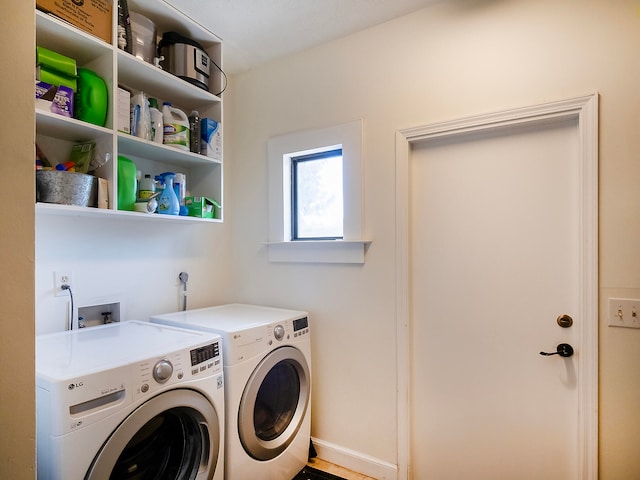 laundry room with washing machine and dryer