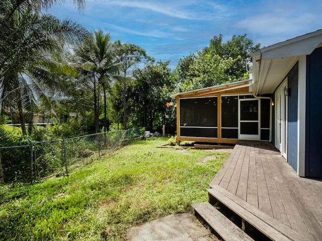 view of yard featuring a sunroom