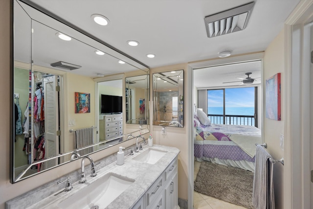 bathroom featuring ceiling fan, tile patterned flooring, and vanity