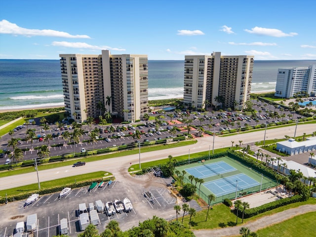 drone / aerial view featuring a view of the beach and a water view