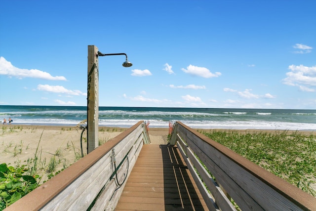 view of community featuring a water view and a view of the beach