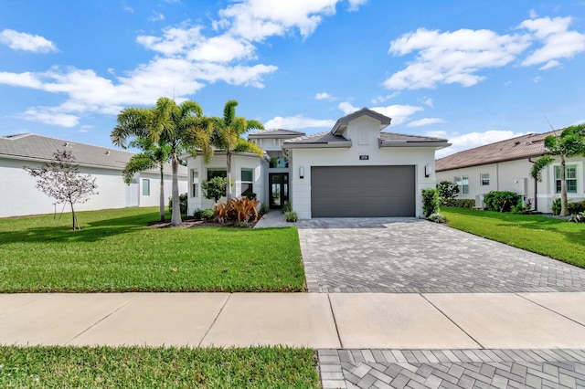 view of front facade featuring a front lawn and a garage