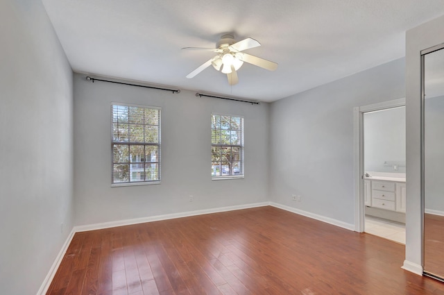 unfurnished room with hardwood / wood-style floors and ceiling fan