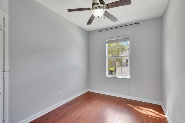 unfurnished room with ceiling fan and wood-type flooring