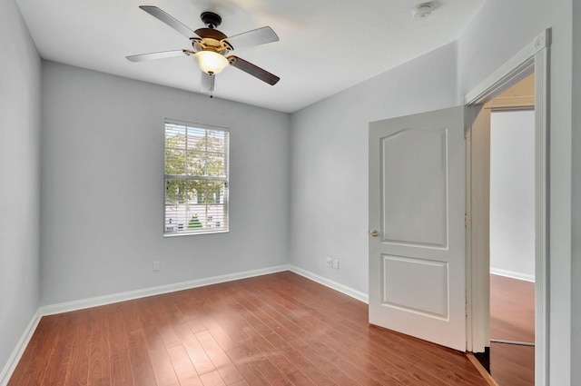 spare room featuring ceiling fan and wood-type flooring