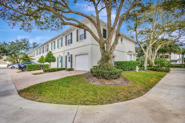 multi unit property featuring a garage